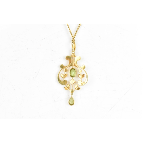 18 - An Edwardian peridot and seed pearl 15ct gold necklace, the attached pendant of foliate design, set ... 