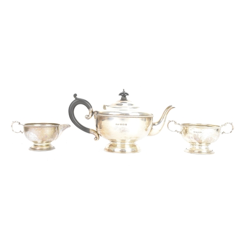 184 - A George V silver tea service, by Marson & Jones, hallmarked Birmingham 1931, the teapot having ebon... 