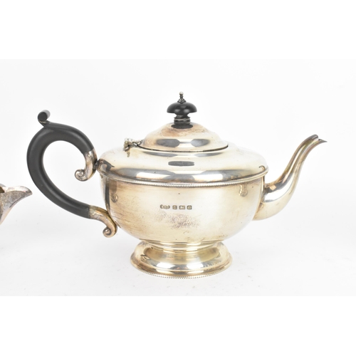 184 - A George V silver tea service, by Marson & Jones, hallmarked Birmingham 1931, the teapot having ebon... 