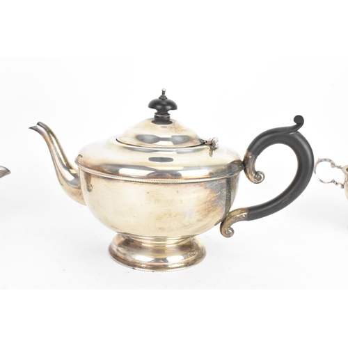 184 - A George V silver tea service, by Marson & Jones, hallmarked Birmingham 1931, the teapot having ebon... 