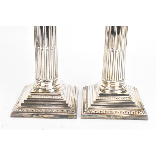 188 - A pair of Elizabeth II silver candlesticks, by Barker Ellis Silver Co, hallmarked Birmingham 1990, i... 