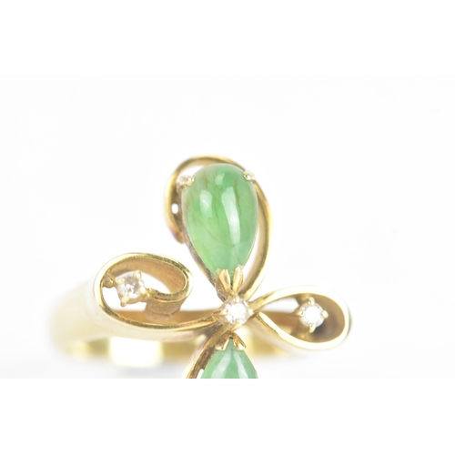 215 - A jade and diamond 14ct yellow gold dress ring, of floral design, with three brilliant cut diamonds,... 