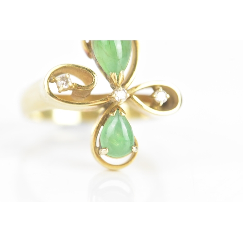 215 - A jade and diamond 14ct yellow gold dress ring, of floral design, with three brilliant cut diamonds,... 