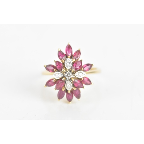 217 - A ruby and diamond 14ct yellow gold cluster dress ring, fashioned as a flower head, with five brilli... 