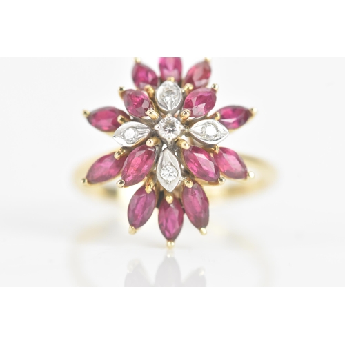 217 - A ruby and diamond 14ct yellow gold cluster dress ring, fashioned as a flower head, with five brilli... 