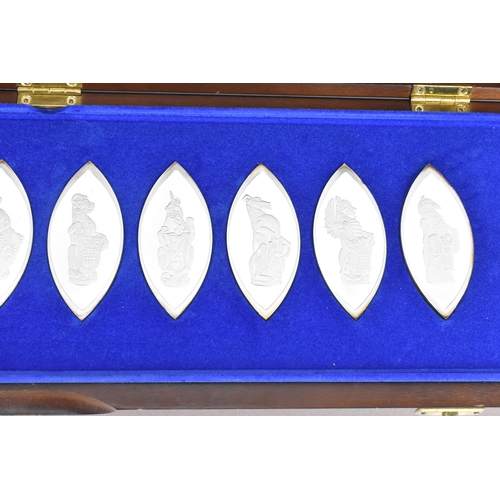 228 - A boxed set of ten silver lozenge shaped ingots titled 'The Queens Beasts' - produced to commemorate... 