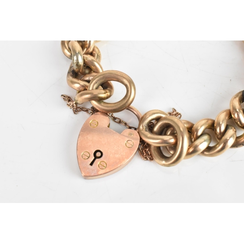 229 - An early 20th century 9ct gold curb link chain bracelet, having a 9ct gold heart shaped locket, hall... 