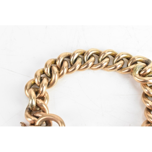 229 - An early 20th century 9ct gold curb link chain bracelet, having a 9ct gold heart shaped locket, hall... 