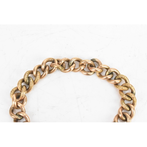 23 - A 9ct rose gold curb link chain bracelet, having a heart shaped padlock clasp and safety chain, stam... 