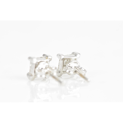 238 - A pair of diamond 18ct white gold earrings, each earring inset with four princess cut diamonds, each... 