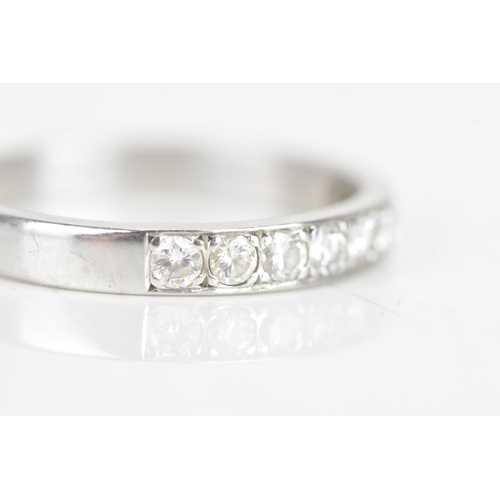 239 - A diamond 18ct white gold half eternity ring, having nine brilliant cut diamonds, each measuring app... 