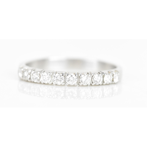 240 - A diamond 18ct white gold half eternity ring, having ten brilliant cut diamonds, each measuring appr... 