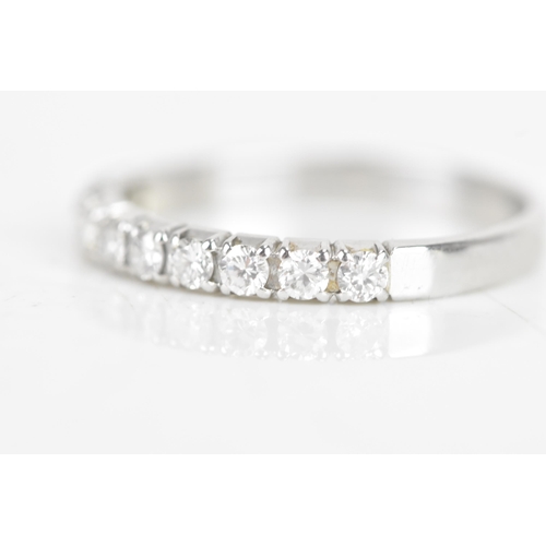 240 - A diamond 18ct white gold half eternity ring, having ten brilliant cut diamonds, each measuring appr... 