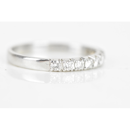 240 - A diamond 18ct white gold half eternity ring, having ten brilliant cut diamonds, each measuring appr... 