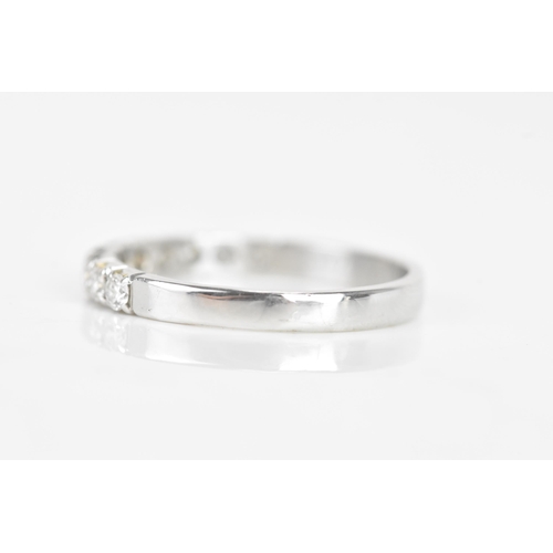 240 - A diamond 18ct white gold half eternity ring, having ten brilliant cut diamonds, each measuring appr... 