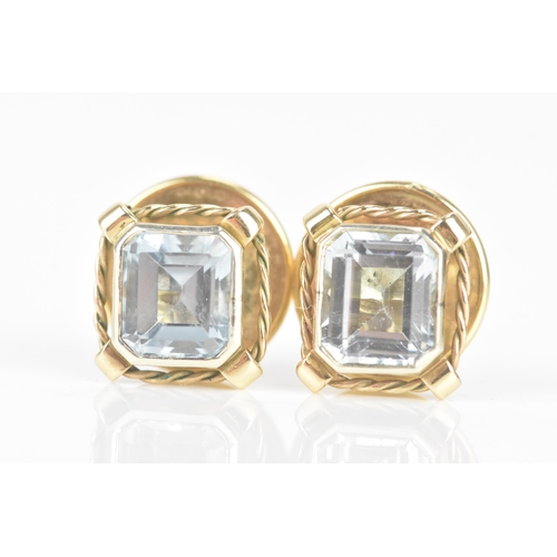 249 - A pair of aquamarine and 9ct gold earrings, the octagonal cut aquamarines measuring approximately 7.... 