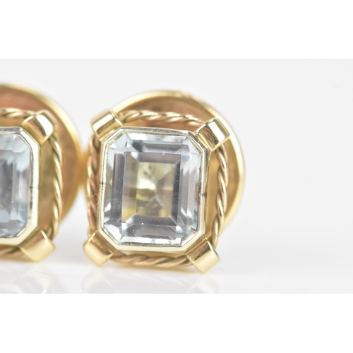 249 - A pair of aquamarine and 9ct gold earrings, the octagonal cut aquamarines measuring approximately 7.... 