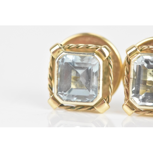 249 - A pair of aquamarine and 9ct gold earrings, the octagonal cut aquamarines measuring approximately 7.... 