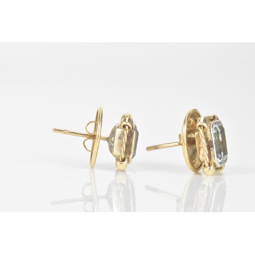 249 - A pair of aquamarine and 9ct gold earrings, the octagonal cut aquamarines measuring approximately 7.... 