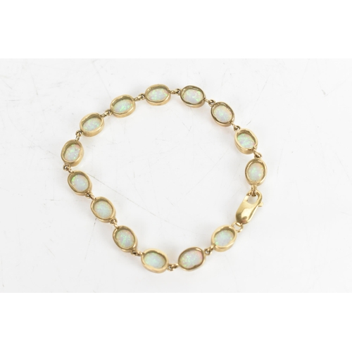 32 - An opal 9ct gold bracelet, the fourteen oval opals colet set, stamped 375, 19cm, 11.7 grams
If there... 