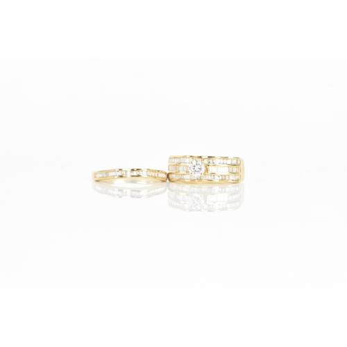 35 - A diamond and 18ct yellow gold ring set, the engagement ring having a brilliant cut diamond, calcula... 