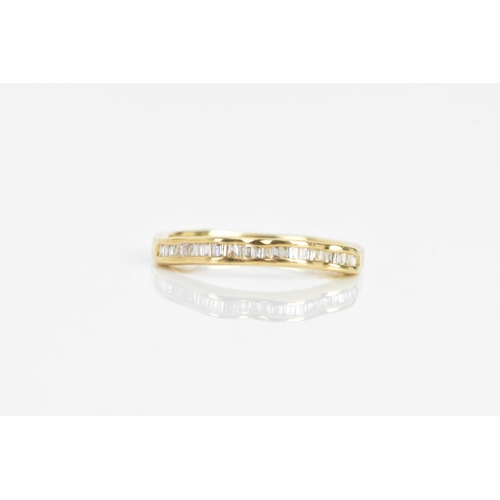 35 - A diamond and 18ct yellow gold ring set, the engagement ring having a brilliant cut diamond, calcula... 