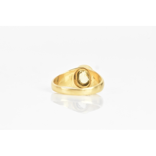 36 - A yellow topaz and gold dress ring, the oval topaz 7.5mm x 5.8mm, in a cushion setting, unmarked, te... 