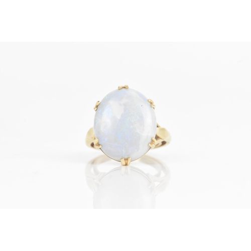 42 - An opal yellow gold ring, the oval opal in a six claw setting, 16.5mm x 14mm, having a pierced galle... 