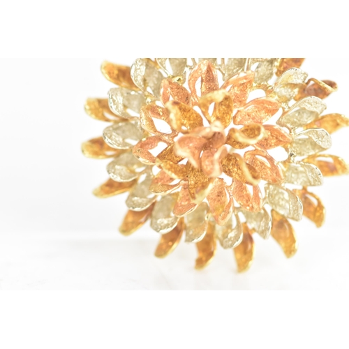 45 - An 18ct tri-coloured gold brooch, fashioned as a flower head, stamped 18K to the reverse, 15.5 grams... 