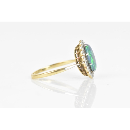 50 - A late 19th/early 20th century opal and diamond cluster yellow gold ring, the central oval opal 10.5... 