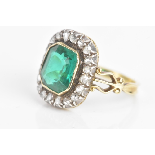 54 - A 19th century green stone and diamond cluster yellow and white metal ring, the central stone 9.4mm ... 