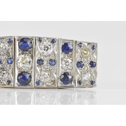 56 - An Art Deco diamond and sapphire white metal part bracelet, composed of seven flexible graduating li... 