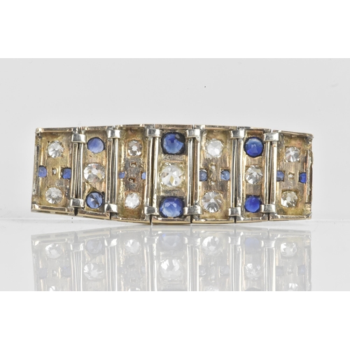 56 - An Art Deco diamond and sapphire white metal part bracelet, composed of seven flexible graduating li... 