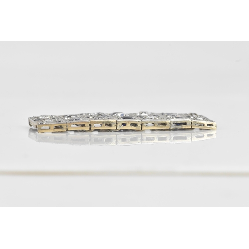 56 - An Art Deco diamond and sapphire white metal part bracelet, composed of seven flexible graduating li... 