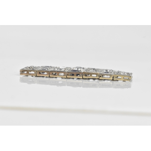 56 - An Art Deco diamond and sapphire white metal part bracelet, composed of seven flexible graduating li... 