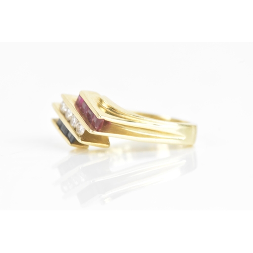 60 - A diamond, sapphire and ruby 14ct yellow gold dress ring, having four channel set central brilliant ... 