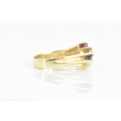 60 - A diamond, sapphire and ruby 14ct yellow gold dress ring, having four channel set central brilliant ... 