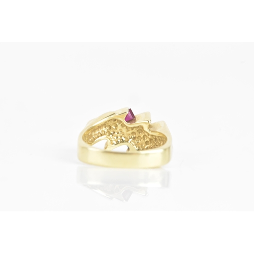 60 - A diamond, sapphire and ruby 14ct yellow gold dress ring, having four channel set central brilliant ... 