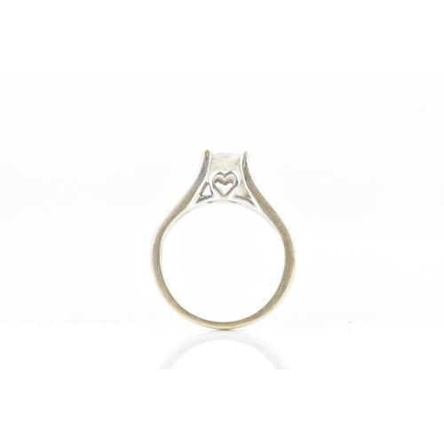 69 - A diamond white gold engagement ring, the central brilliant cut diamond calculated weight 0.6ct, cla... 