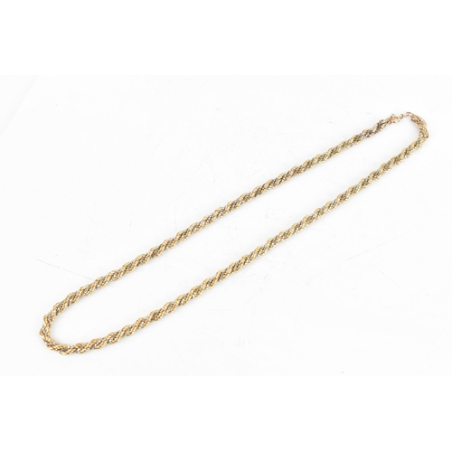 7 - A 9ct gold bi-coloured rope twist necklace, having a bolt ring clasp, stamped 375, 46cm, 16.9 grams
... 