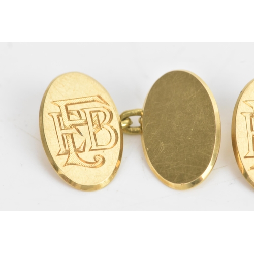 77 - A pair of 18ct yellow gold cufflinks, each having chain links with oval formed ends, engraved with i... 