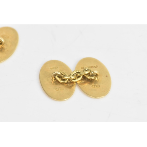 77 - A pair of 18ct yellow gold cufflinks, each having chain links with oval formed ends, engraved with i... 