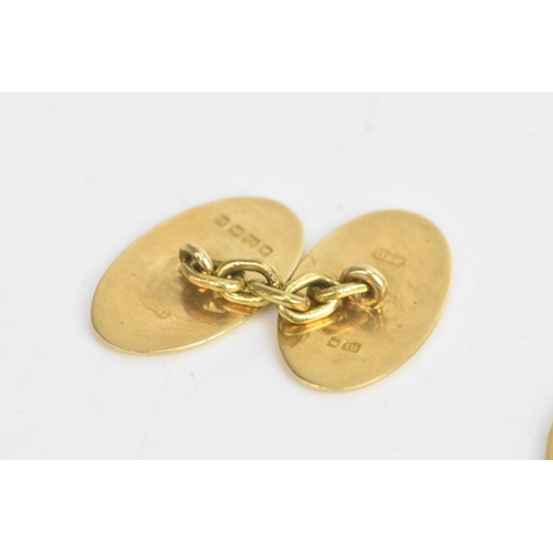 77 - A pair of 18ct yellow gold cufflinks, each having chain links with oval formed ends, engraved with i... 