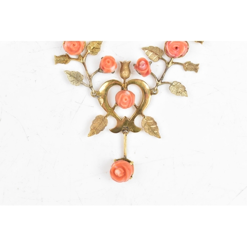 9 - An Art Nouveau coral necklace, the six carved corals fashioned as roses set within a yellow metal fl... 