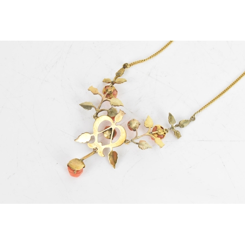 9 - An Art Nouveau coral necklace, the six carved corals fashioned as roses set within a yellow metal fl... 