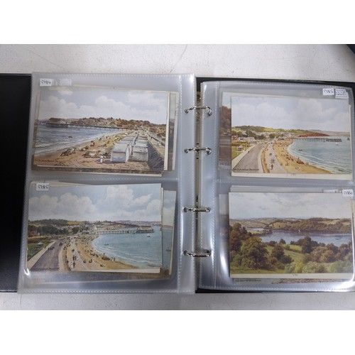 462 - Approximately 280 postcards presented in three albums depicting scenes from Devon, Torquay and Paign... 