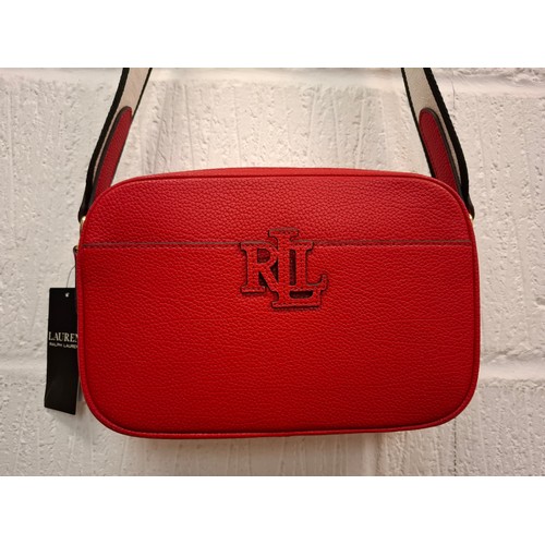 1 - Ralph Lauren- A new red leather crossover bag having original tags with branded canvas shoulder stra... 