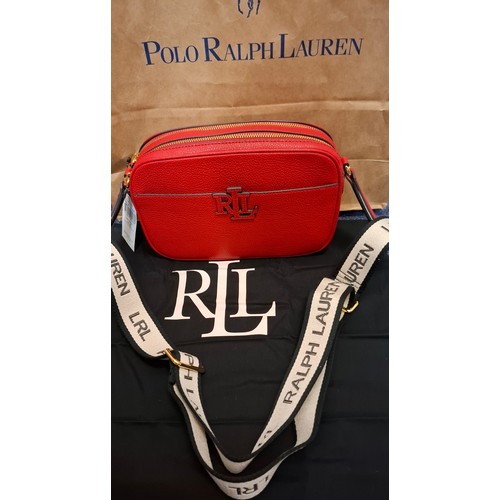 Ralph Lauren- A new red leather crossover bag having original tags with branded canvas shoulder strap together with branded dust bag and merchandise bag. Location:
Condition:New.