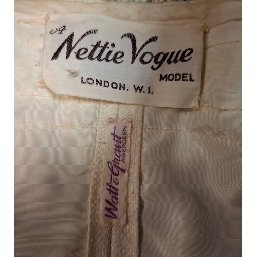 37 - A collection of vintage ladies dresses to include a Nettie Vogue Model cream satin and lace straples... 