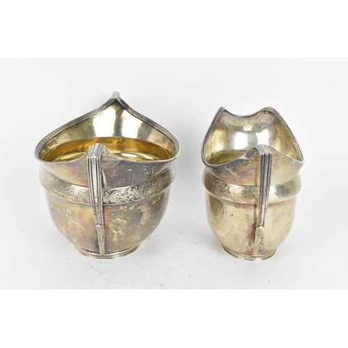 255 - A George III silver cream jug and matching sugar bowl, by John Emes, hallmarked London 1804, each ha... 